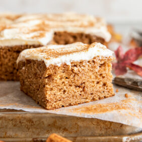 square slice of applesauce cake on baking pan.