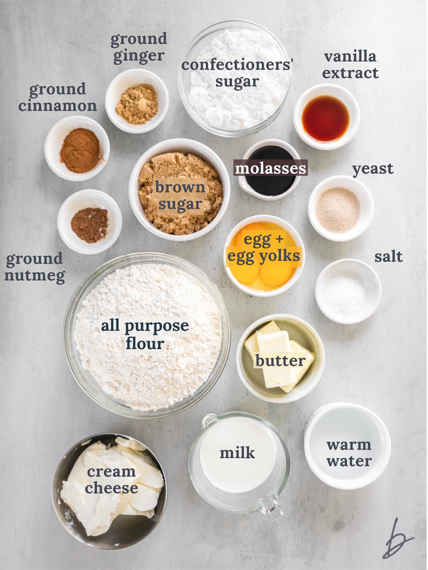 bowls of ingredients to make gingerbread cinnamon rolls.