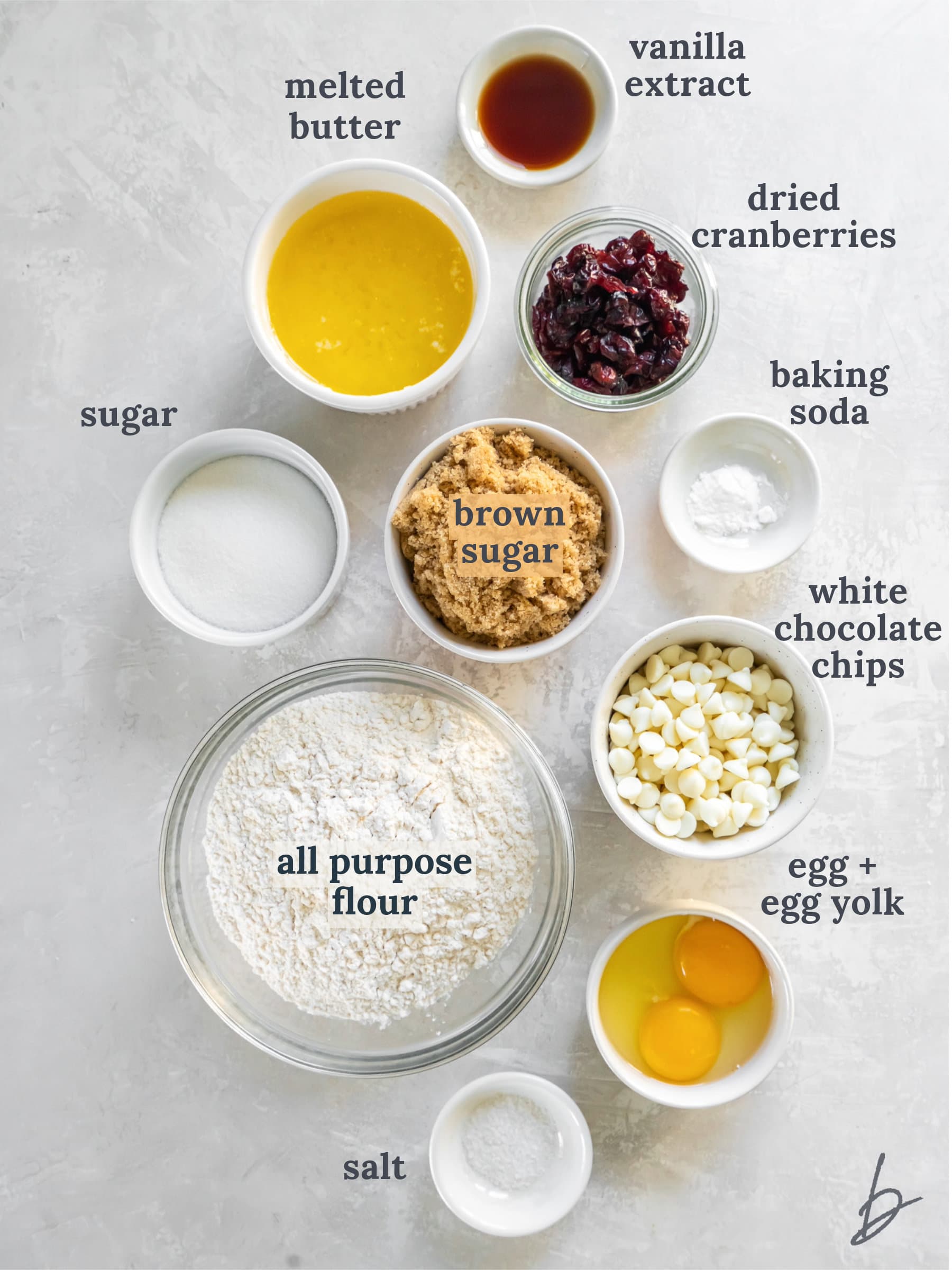 bowls of ingredients to make white chocolate cranberry cookies.