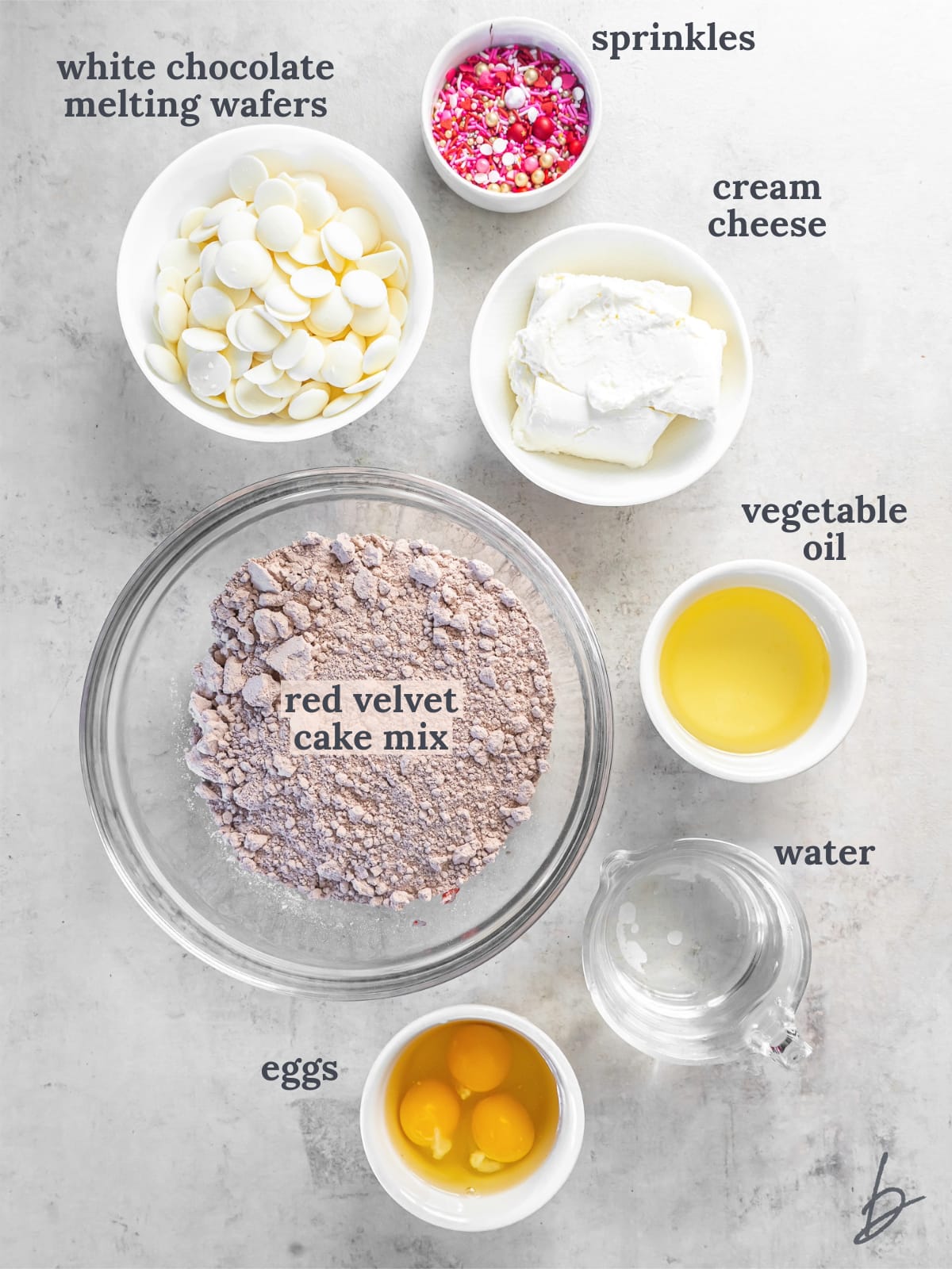 bowls of ingredients to make red velvet cake balls.