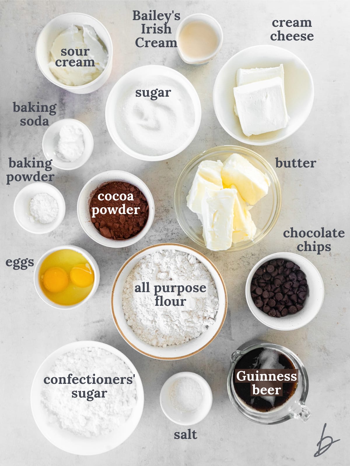 bowls of ingredients to make chocolate guinness cake with bailey's cream cheese frosting.