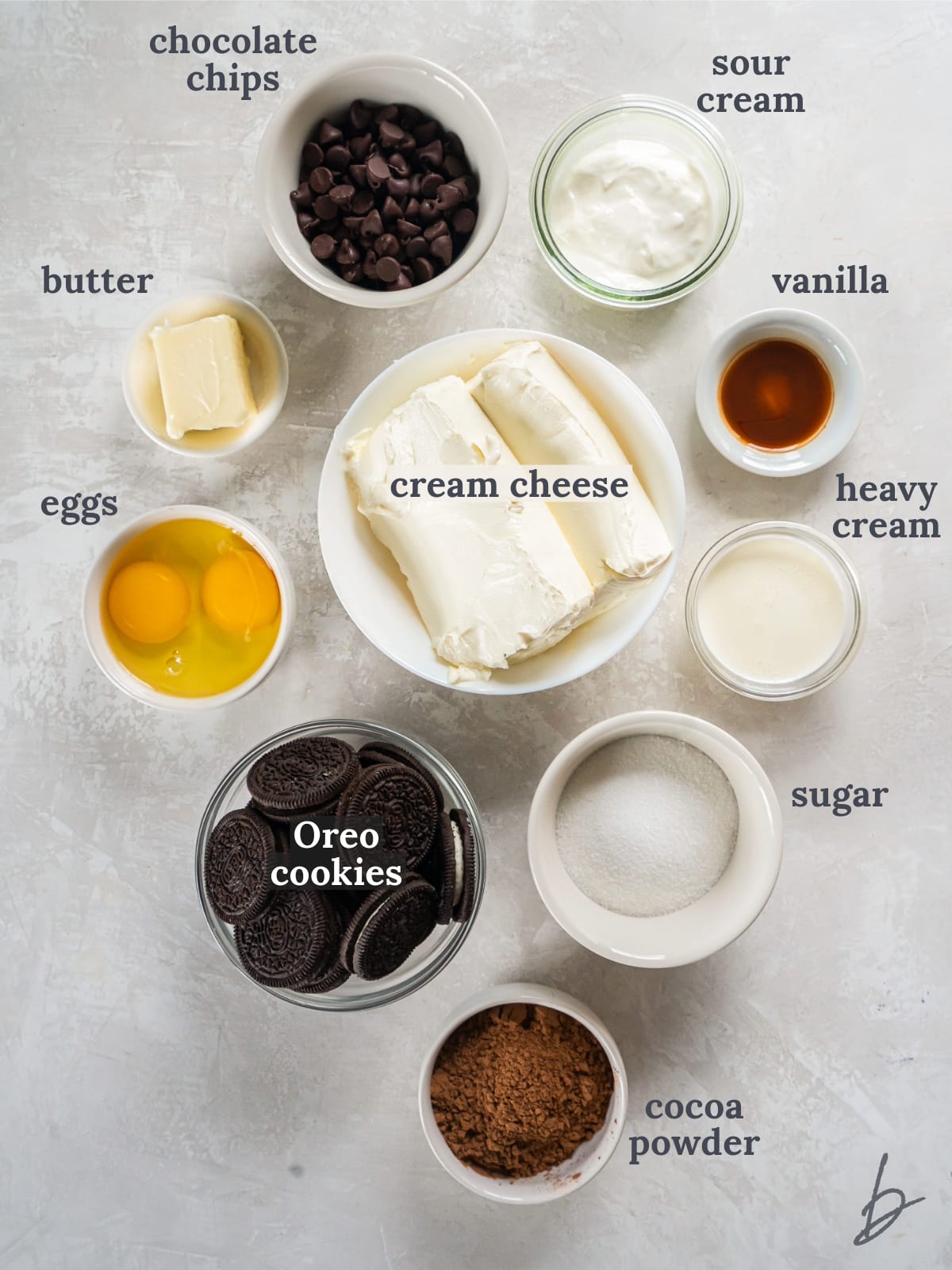bowls of ingredients to make mini chocolate cheesecakes.