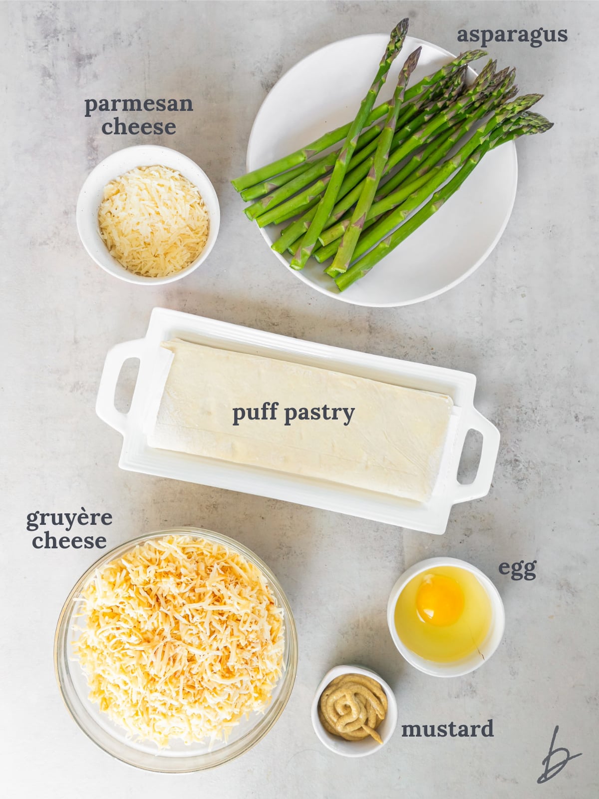 bowls and plate of ingredients to make asparagus tart.