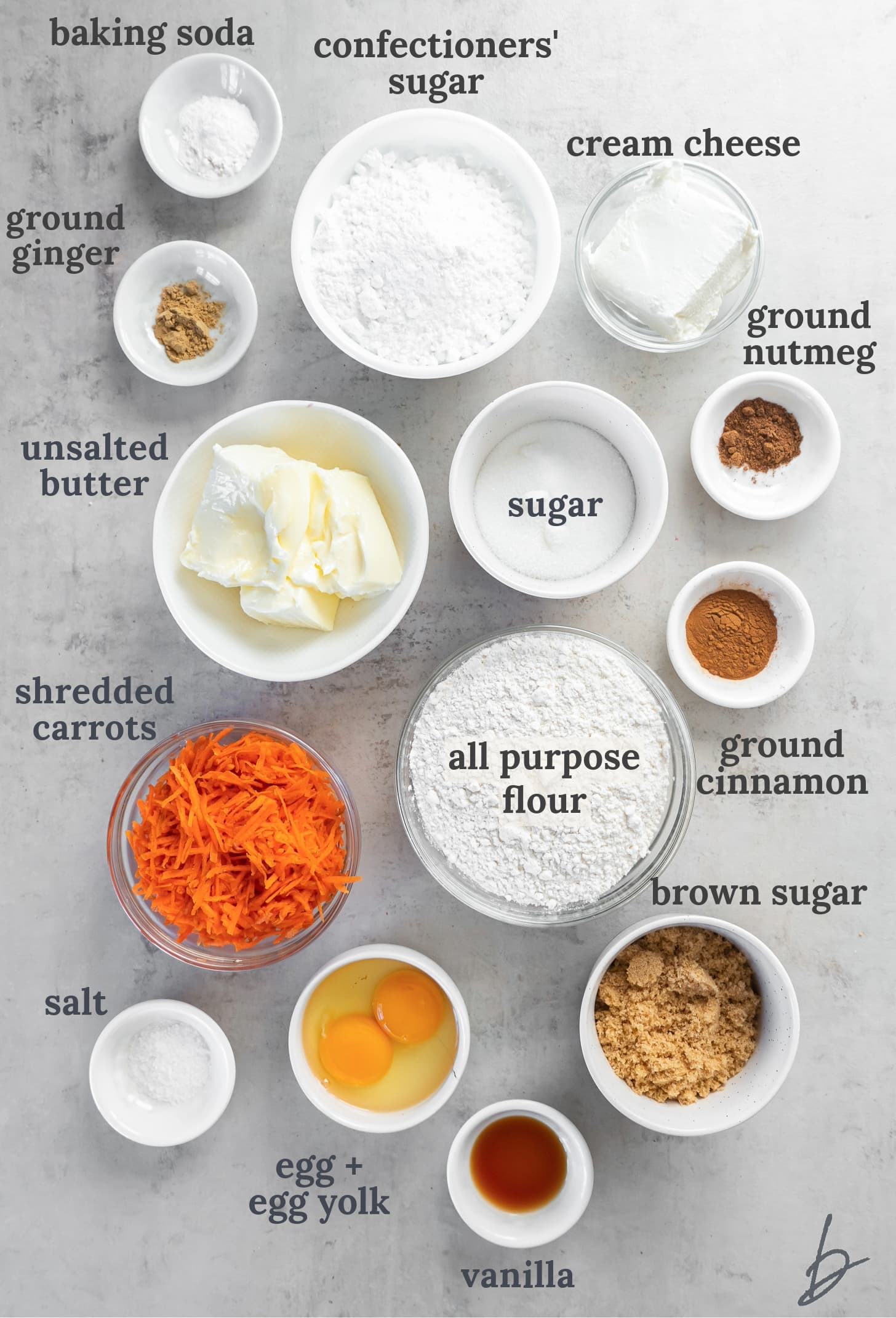 bowls of ingredients to make carrot cake cookies with cream cheese frosting.