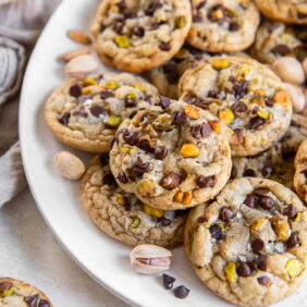 salted chocolate chip pistachio cookies on a plate.