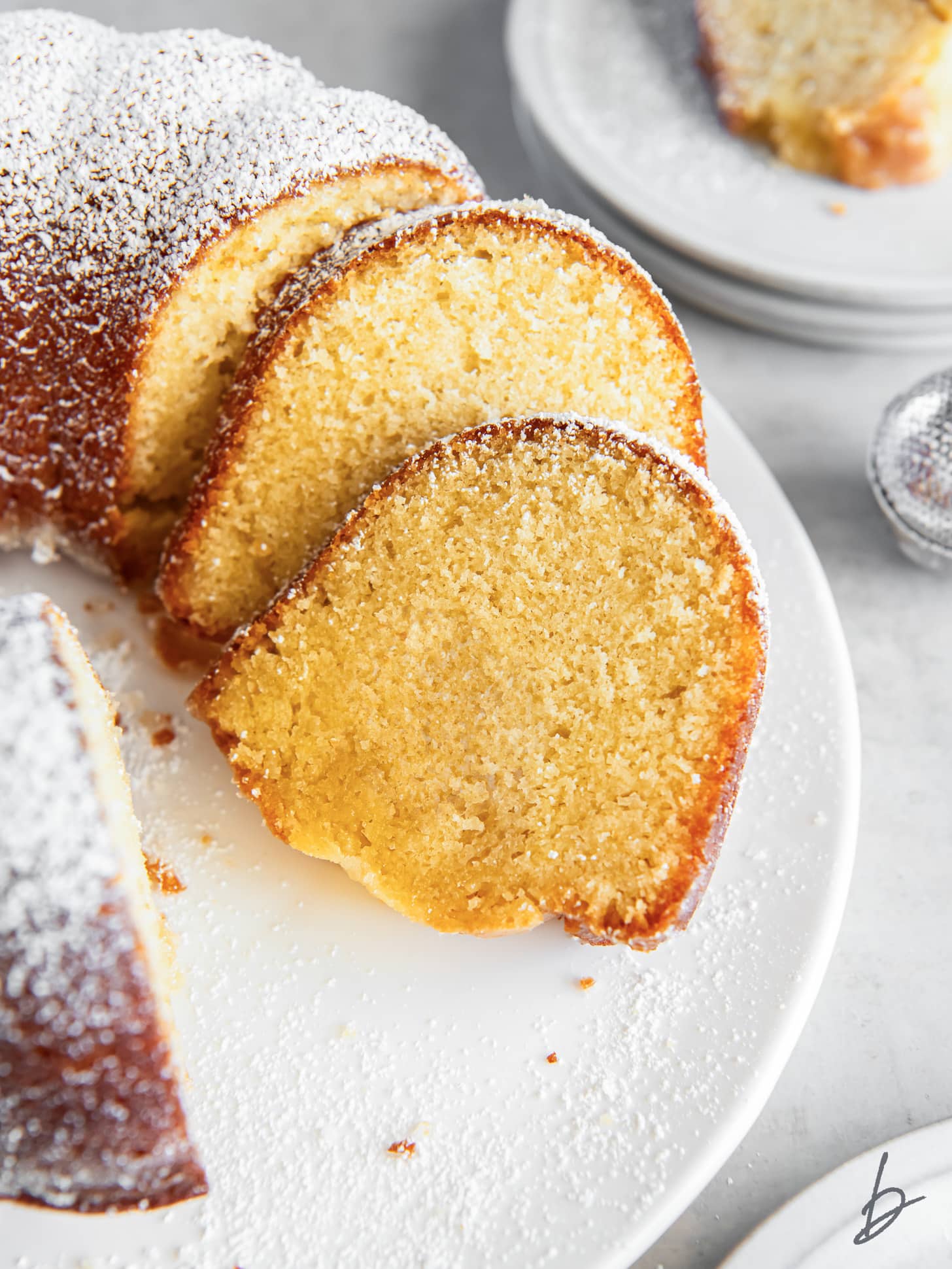slices of kentucky butter cake leaning against each other on white plate.