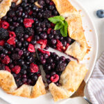 slice of berry galette being pulled away from the rest of the galette.