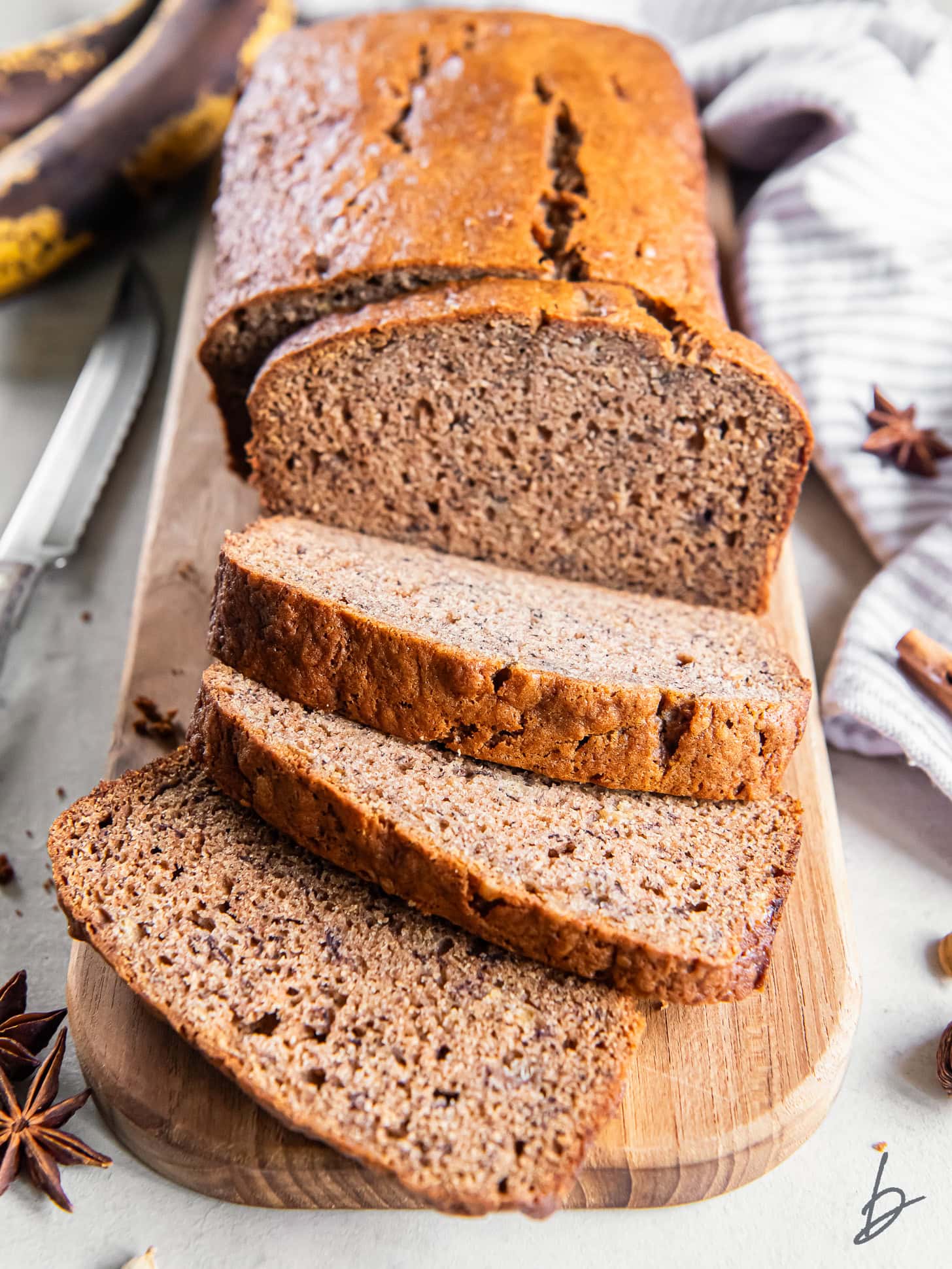 loaf of chai banana bread with a few slices cut off the end.
