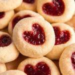 jam heart cookies in a pile on top of each other.