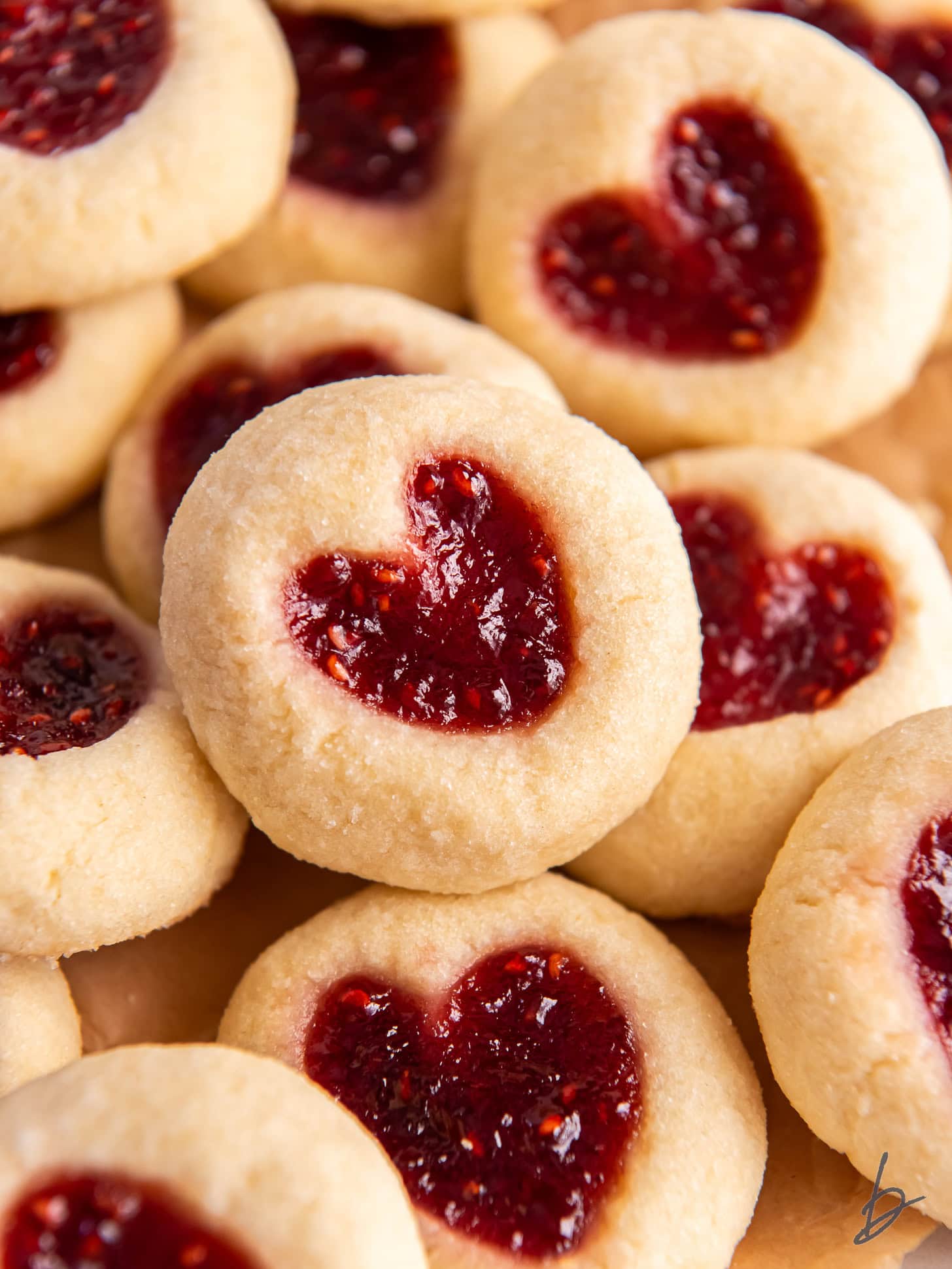 jam heart cookies in a pile on top of each other.