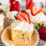 tres leches cupcake cut in half to show milk soaked filling.