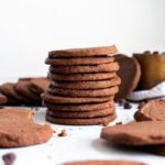 stack of chocolate icebox cookies profile view.