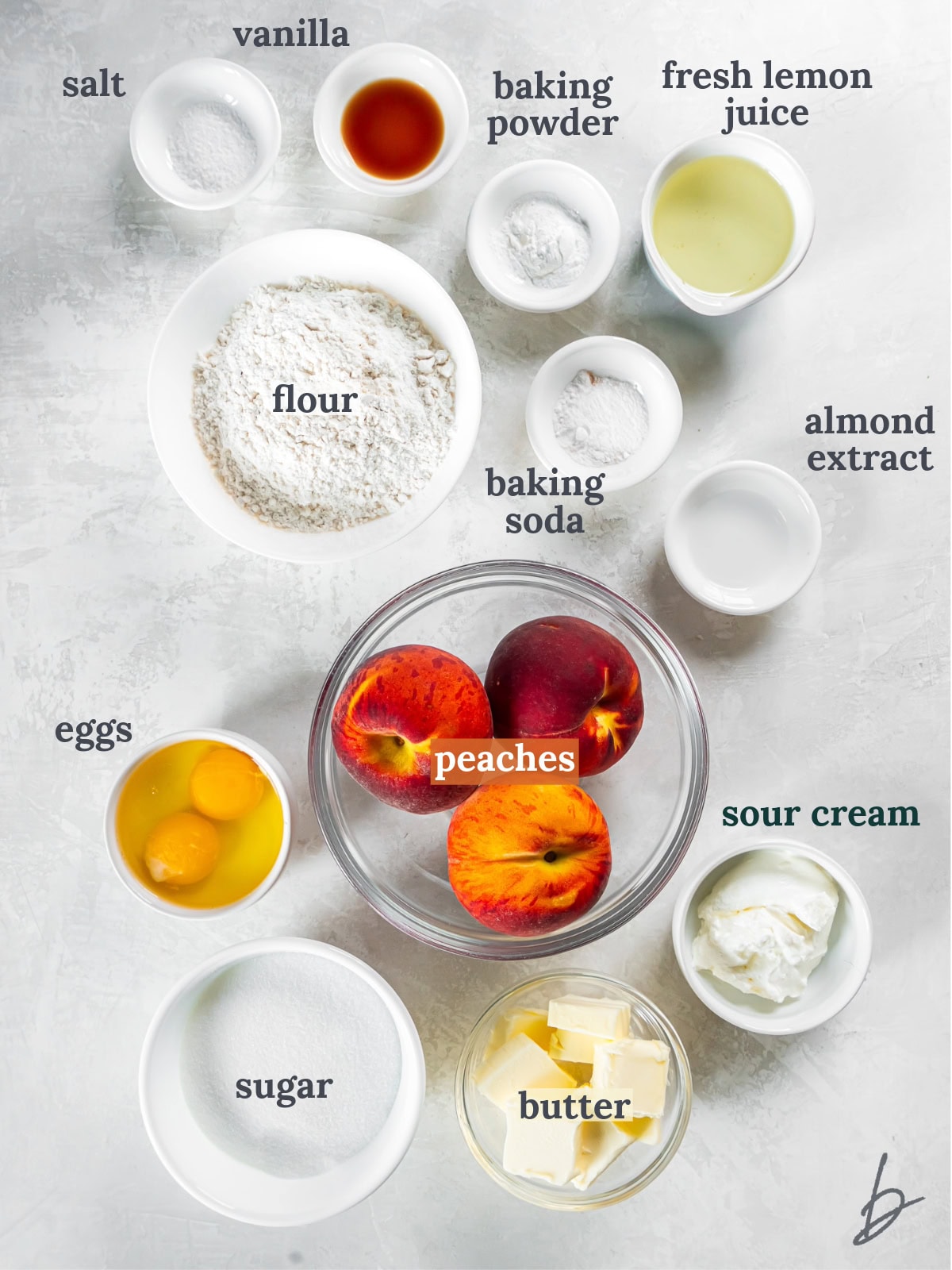 tabletop with bowls of ingredients to make fresh peach cake.