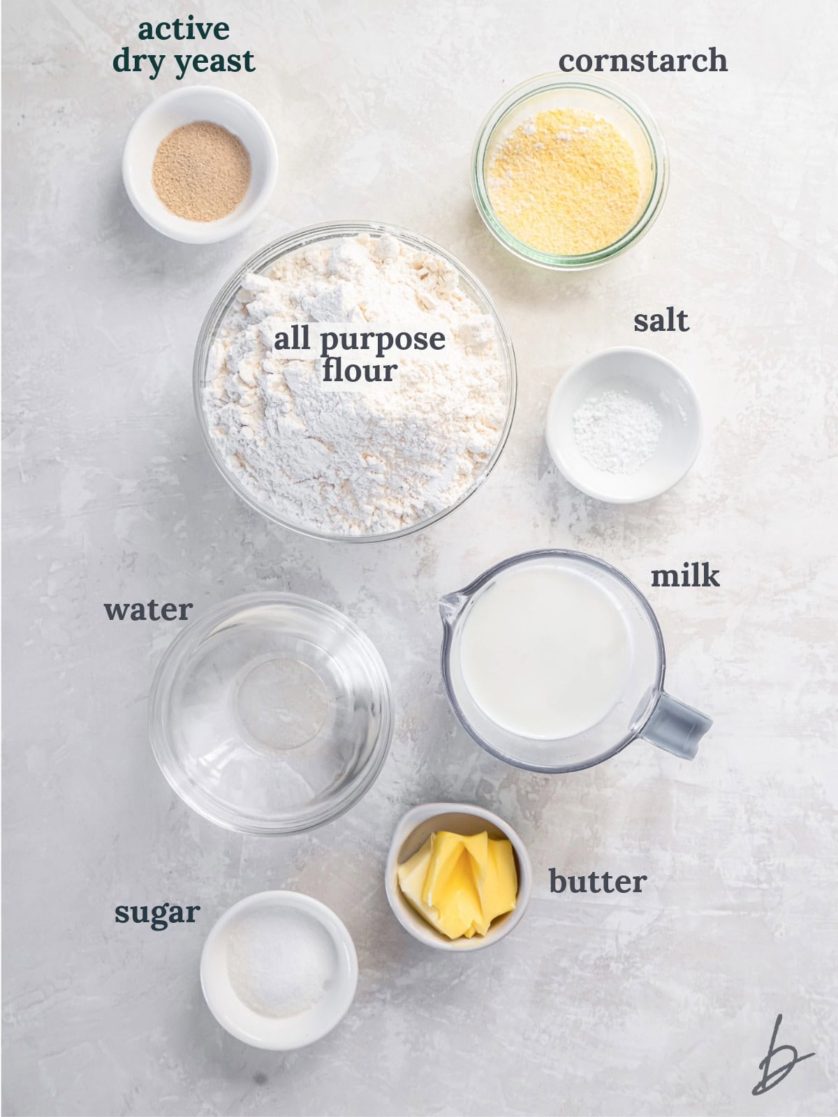 Bowls of flour, milk, water, butter and sugar.