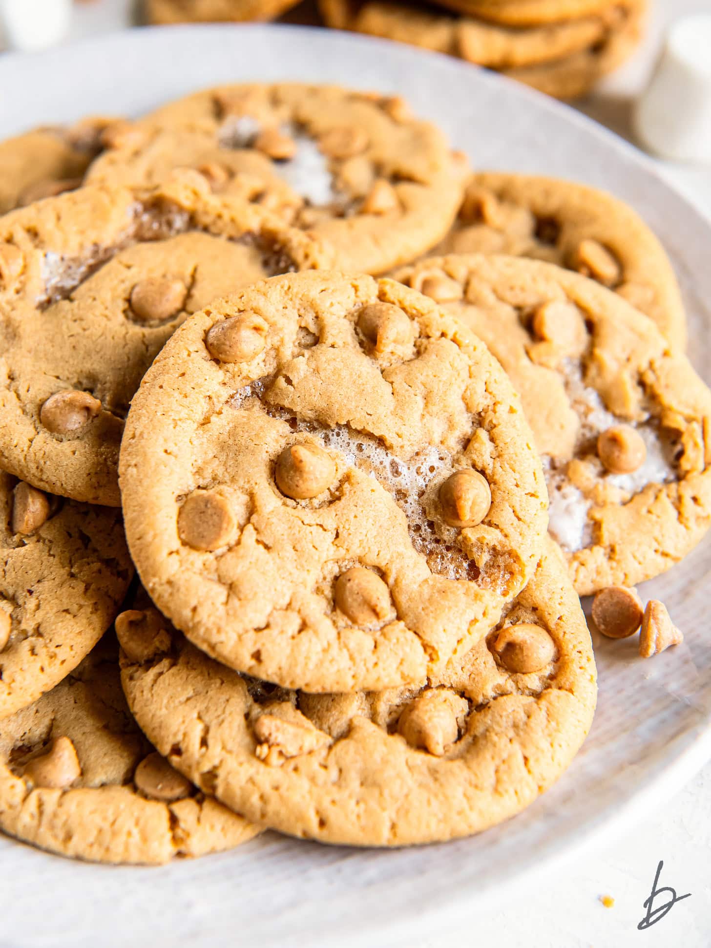 plate of fluffernutter cookies with marshmallows and peanut butter chips.