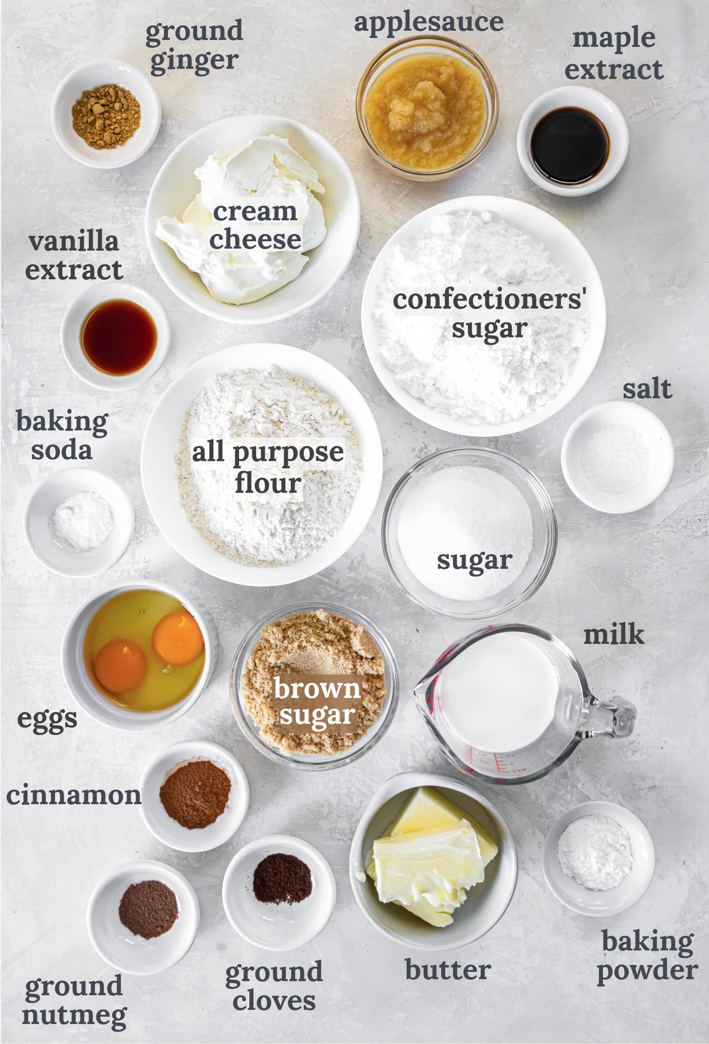 Small bowls with ingredients for making spice cake cupcakes.