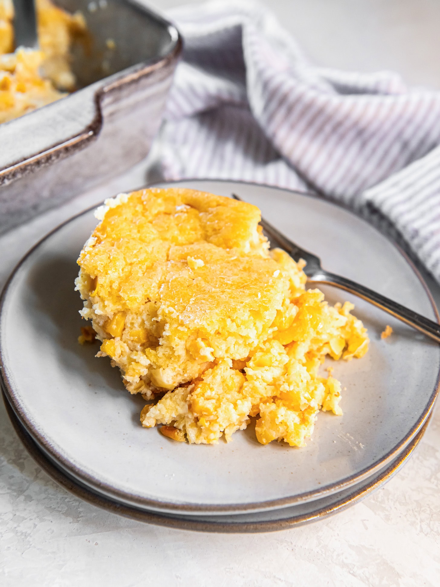 Cornbread pudding served on a small plate.