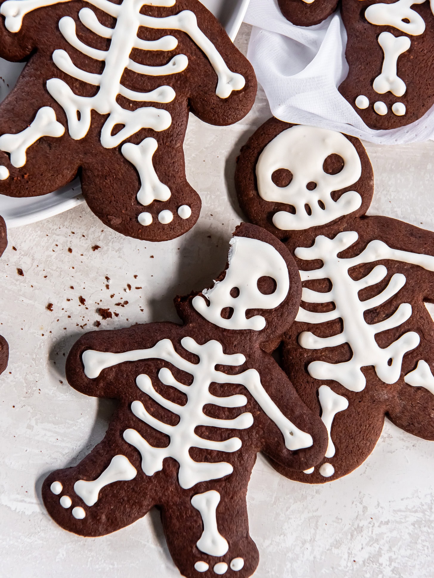 Skeleton cookie with a bite taken out.