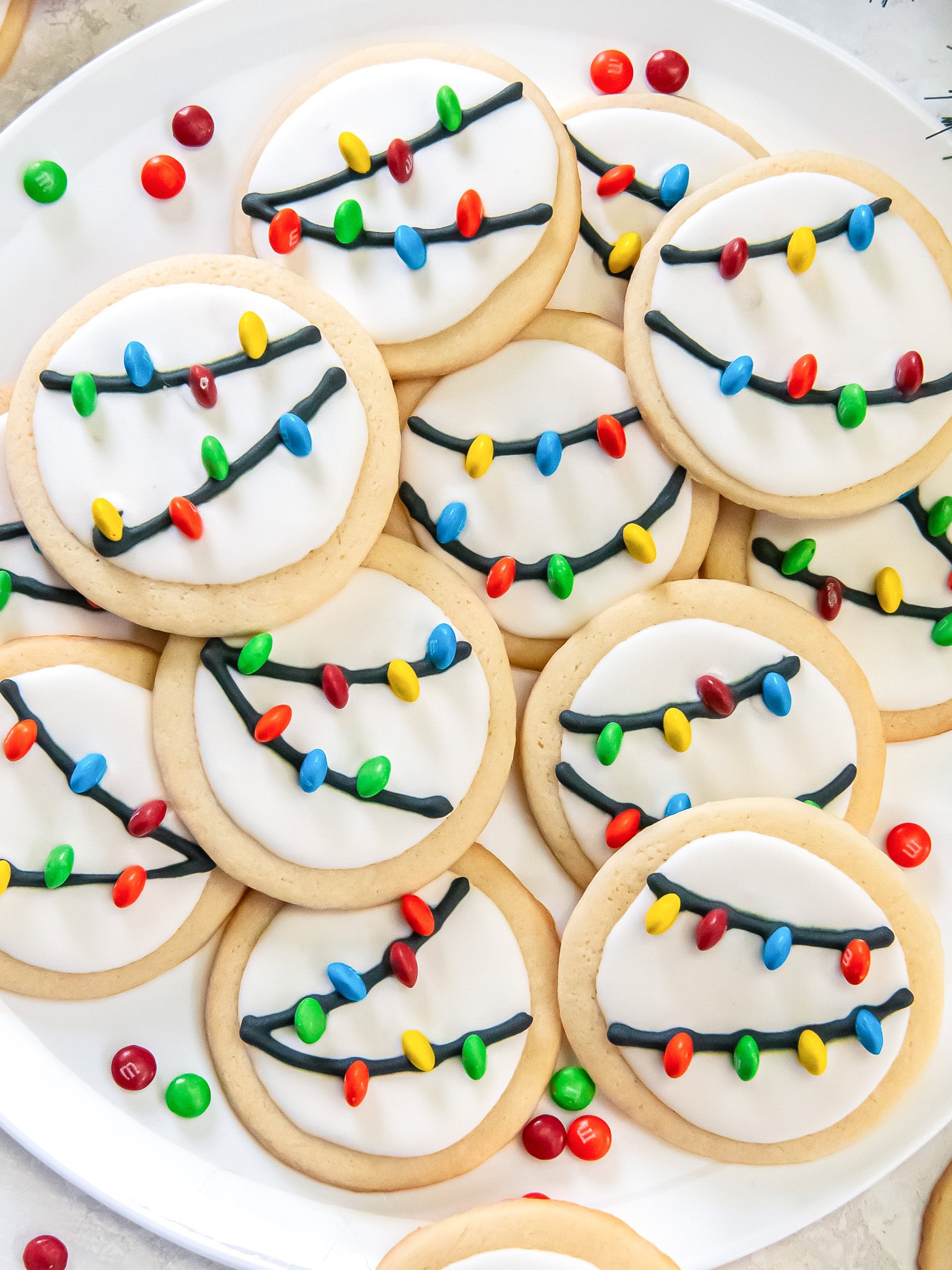 A plate filled with Christmas light cookies.