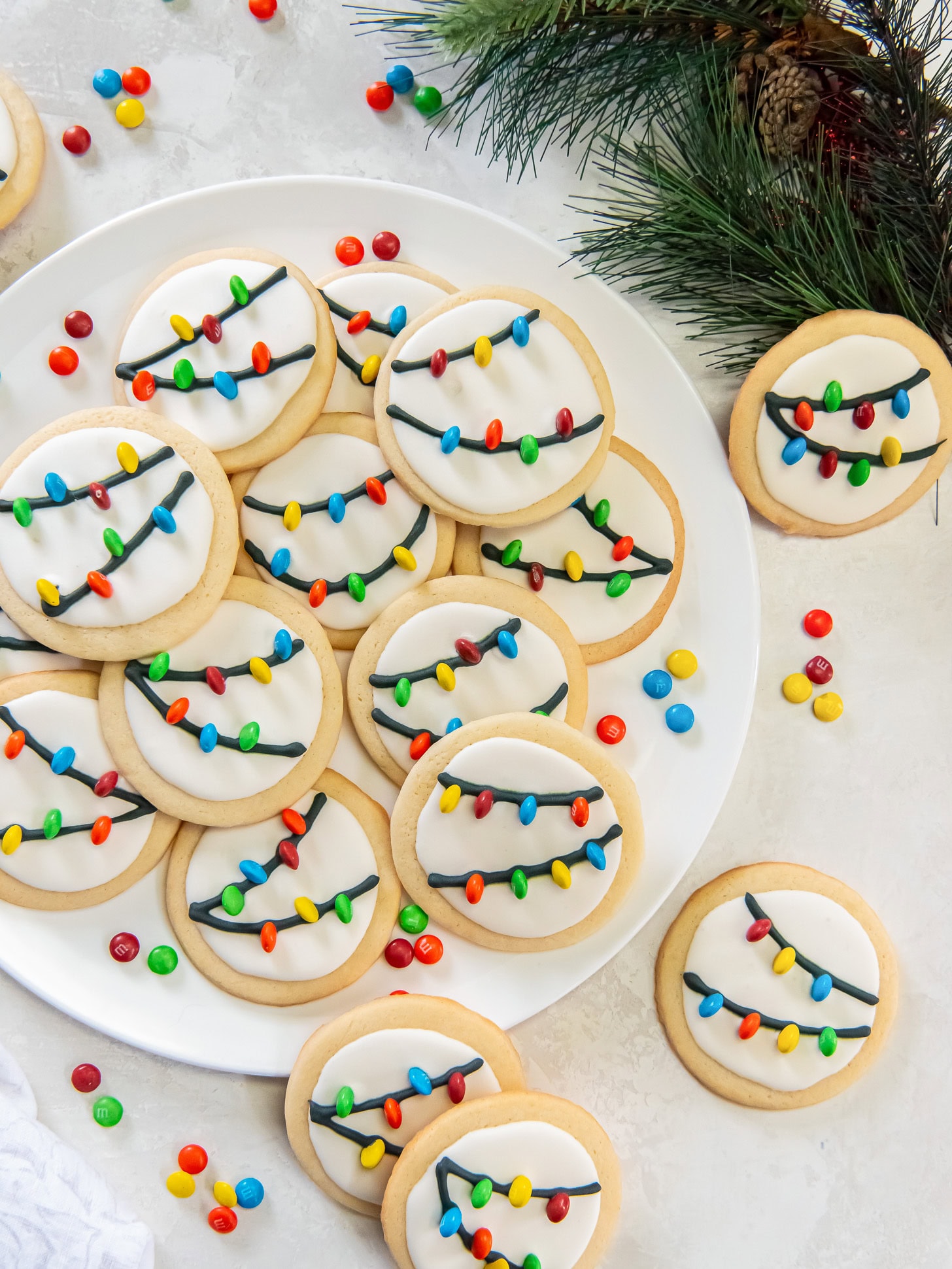 Plate filled with Christmas light cookies.