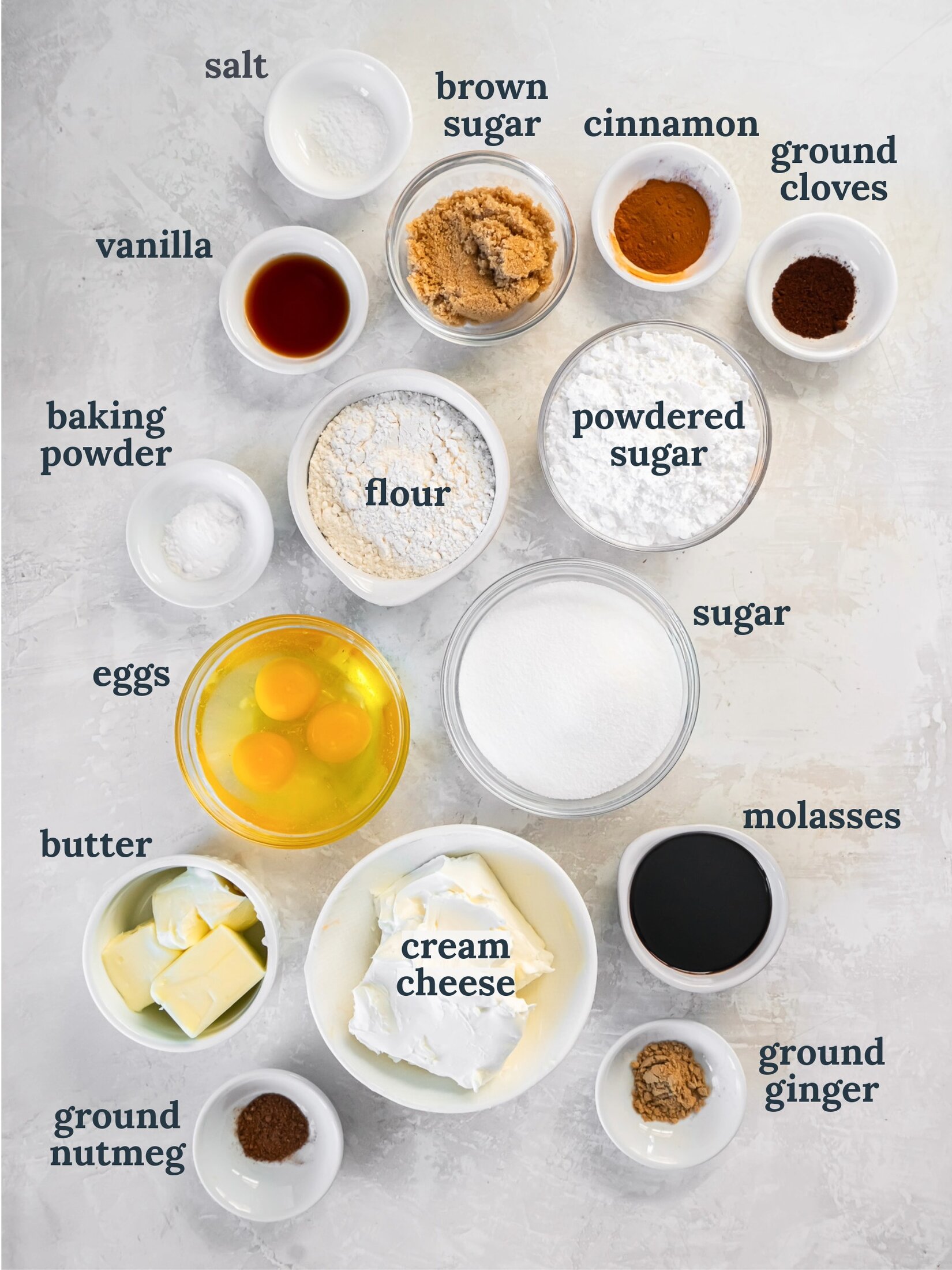 Small bowls with flour, sugar, spices, butter and cream cheese.