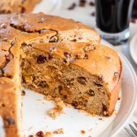Irish porter cake with a slice taken removed.