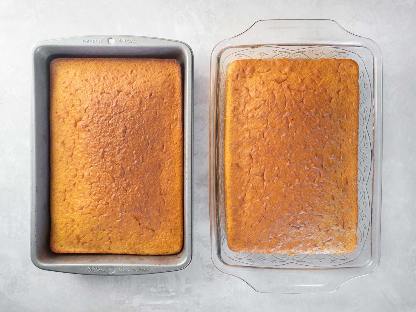 Showing one cake baked in a glass pan and one baked in a metal pan.