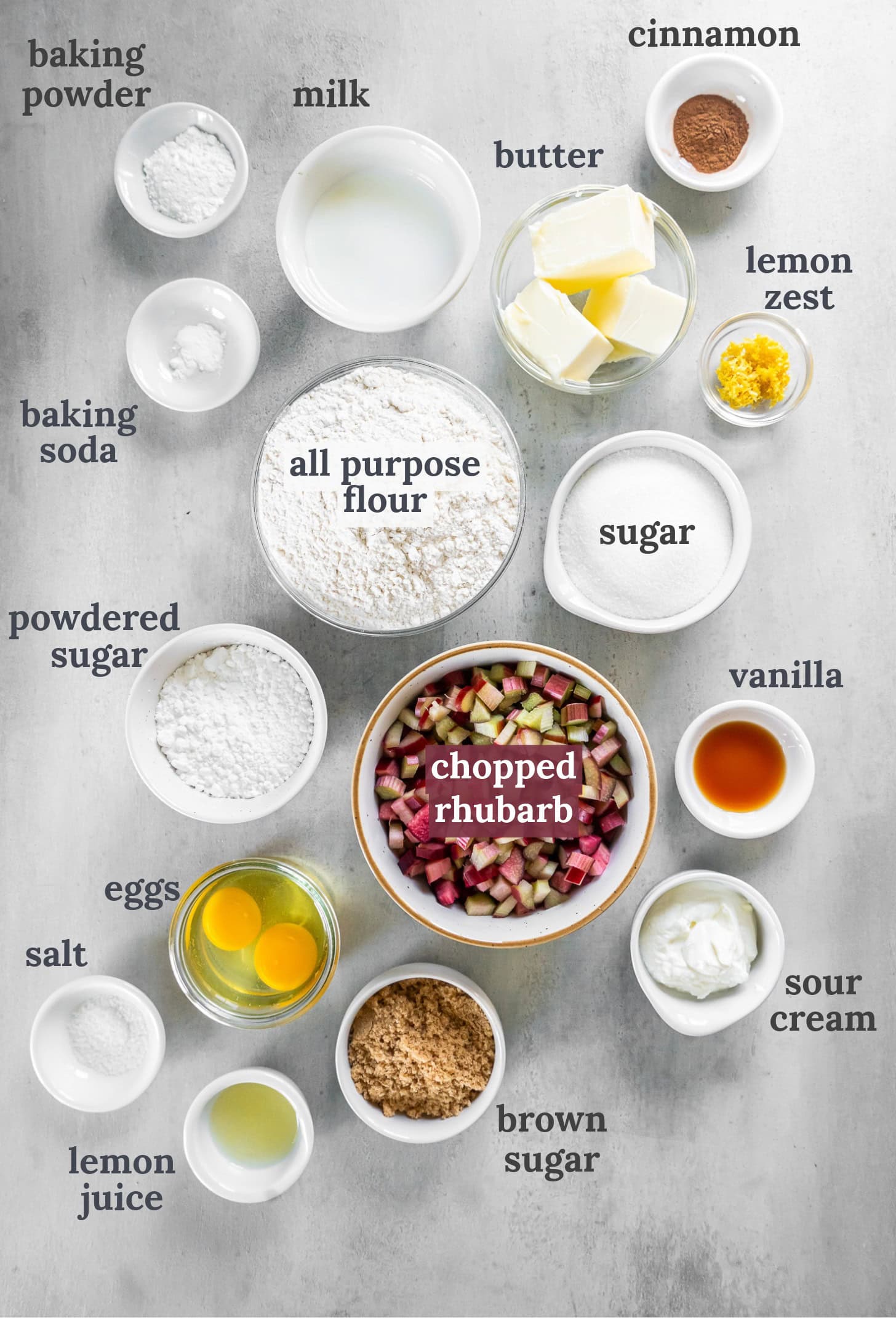 Bowls with chopped rhubarb, flour, sugar, eggs, butter, vanilla and salt.