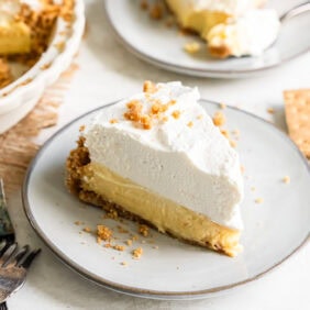 Vanilla cream pie served on a white plate.