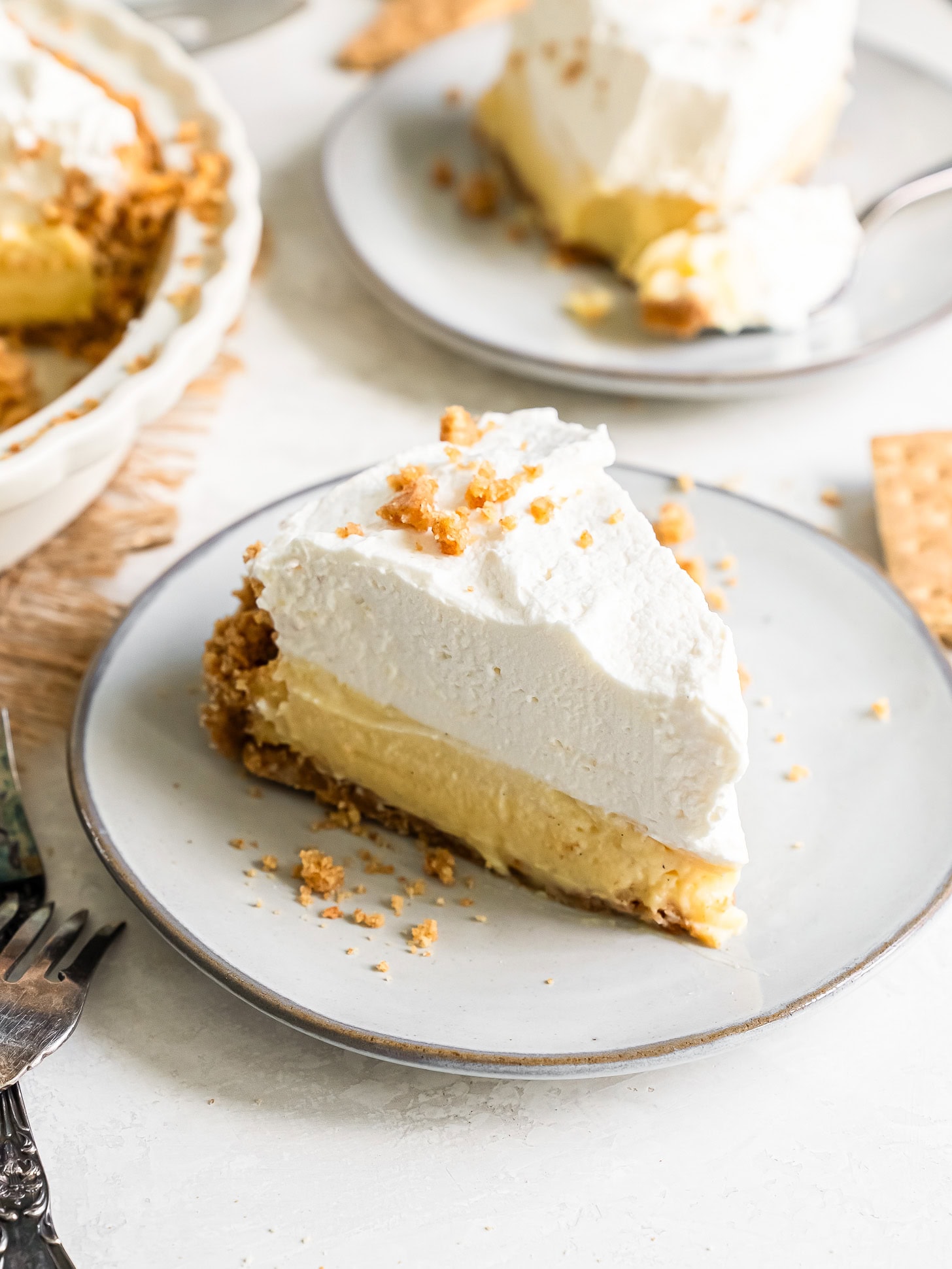 Vanilla cream pie served on a white plate.