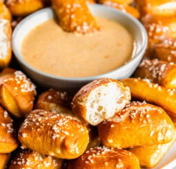 Pretzel bites served with a cheese sauce.