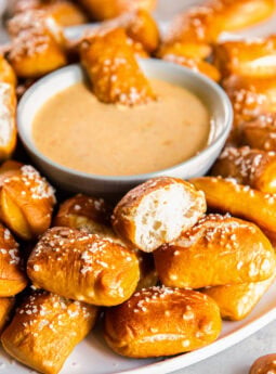 Pretzel bites served with a cheese sauce.