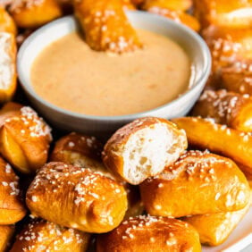 Pretzel bites served with a cheese sauce.