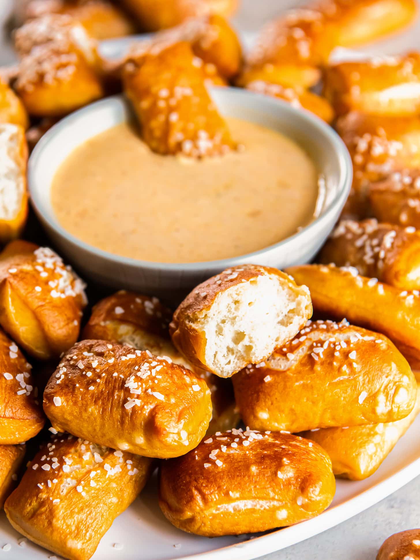 Pretzel bites served with a cheese sauce.