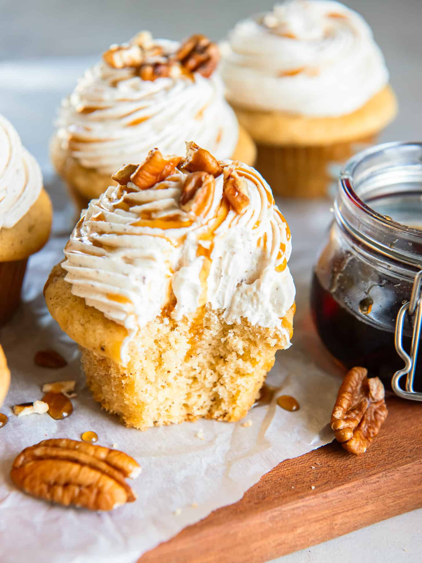 Maple cupcake with a bite taken out.
